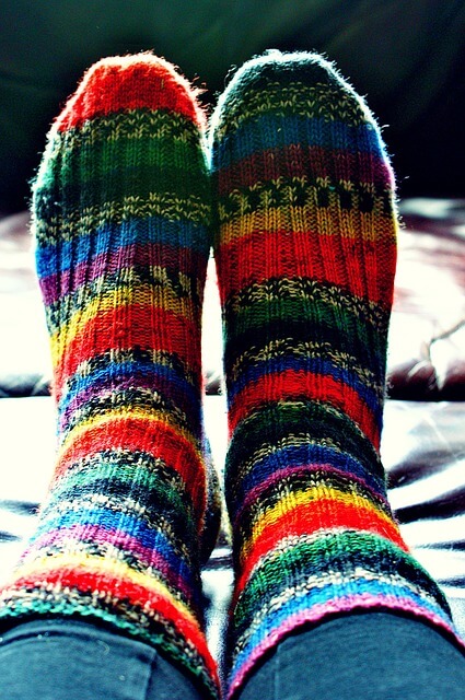 Feet wearing thick woolly socks